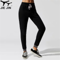 2020 Jiejin en gros de joggeurs noirs massifs solides pantalons de jogger élastique pour hommes